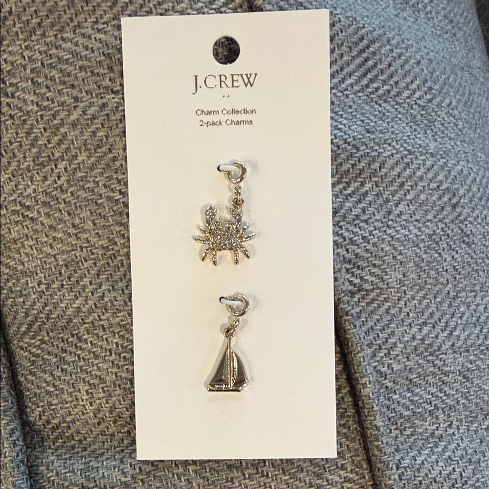 J. Crew  2 pack gold  Nautical Charms. One sailboat and one cubic zirconia crab